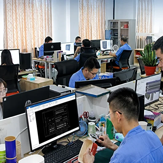 DISCOVER engineers reviewing paper container drawings and samples