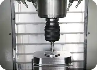 A HAAS VF-2SS CNC machining center precision-milling a component for a Discover paper cup machine.