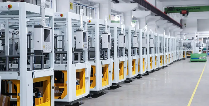 Clean, modern production floor with a well-maintained forming machine in the background