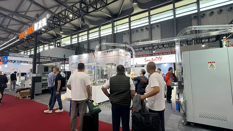 Crowd gathered around DISCOVER paper cup machine booth at All in Print China 2026 Shanghai