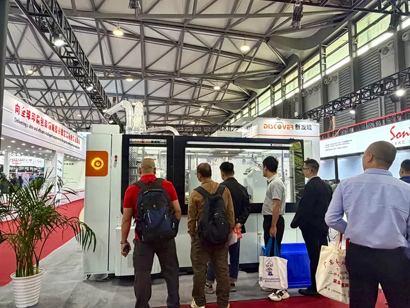 Visitors watching DISCOVER paper cup machine live demonstration at All in Print China 2026 Shanghai